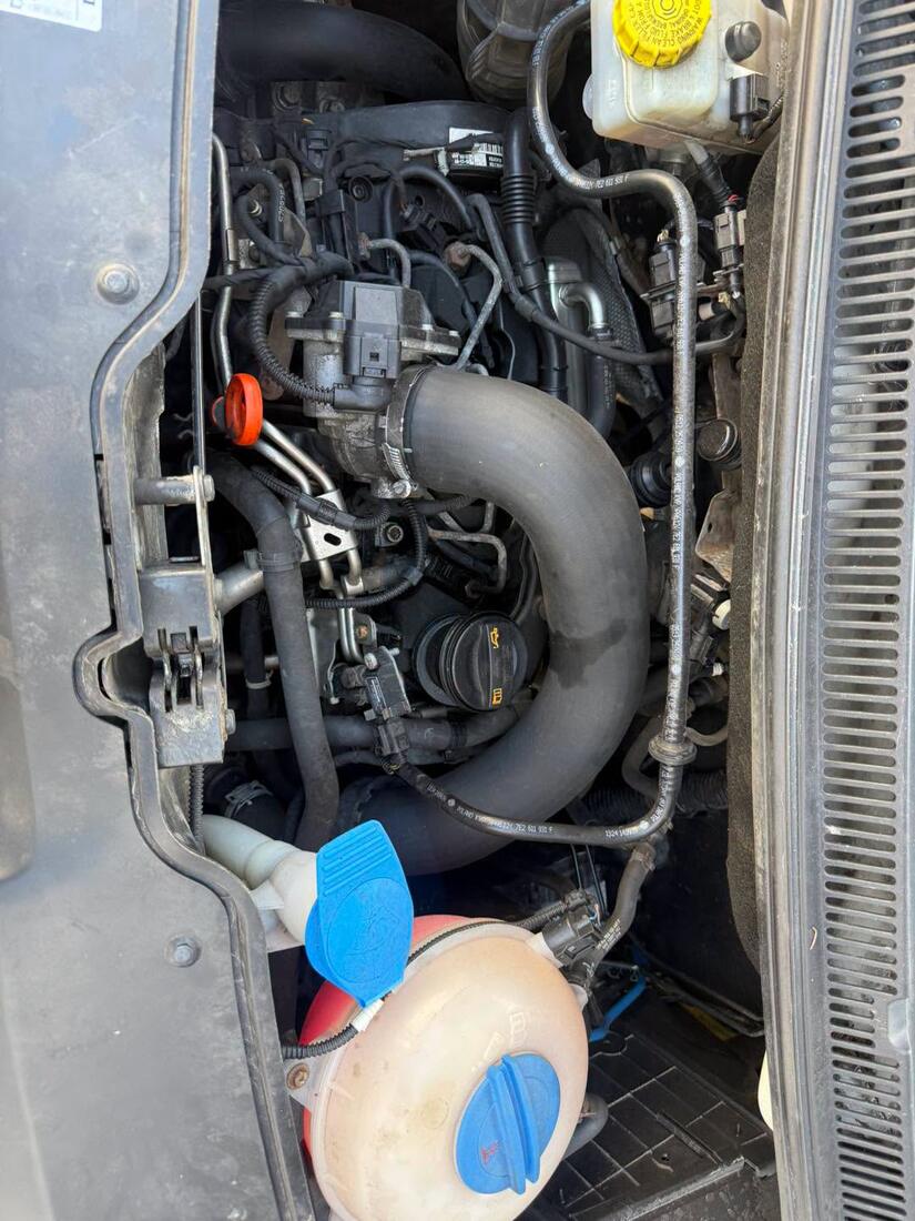 VW Transporter engine bay showing coolant hoses and expansion tank