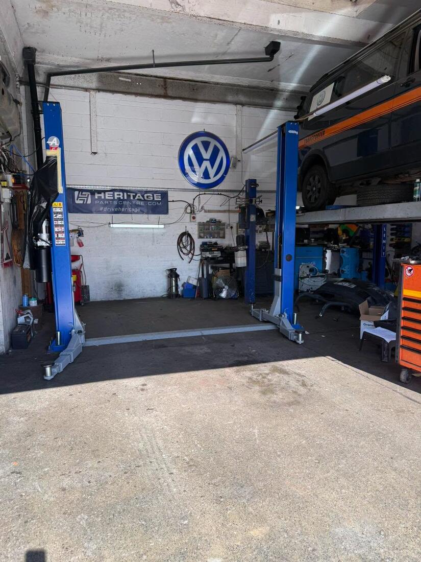 VW Transporter up on the two post lift in the T5 Spares workshop